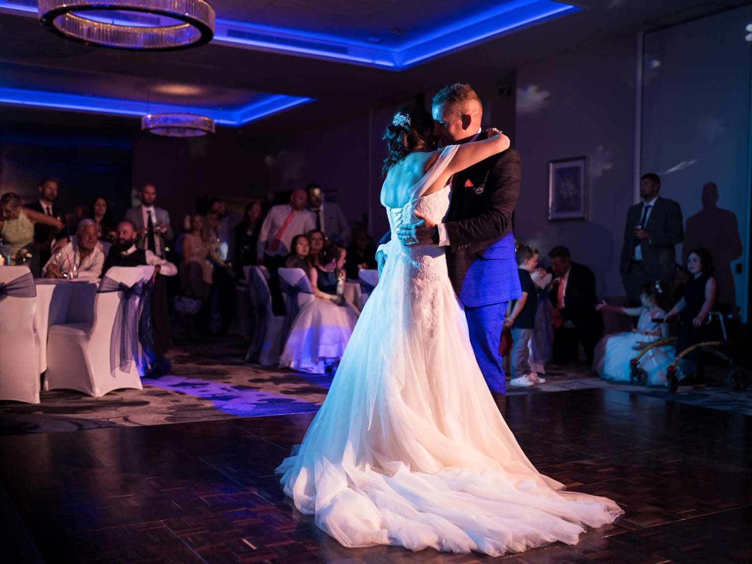 Crowd looks on for the first dance at this Tewkesbury Park Hotel Wedding