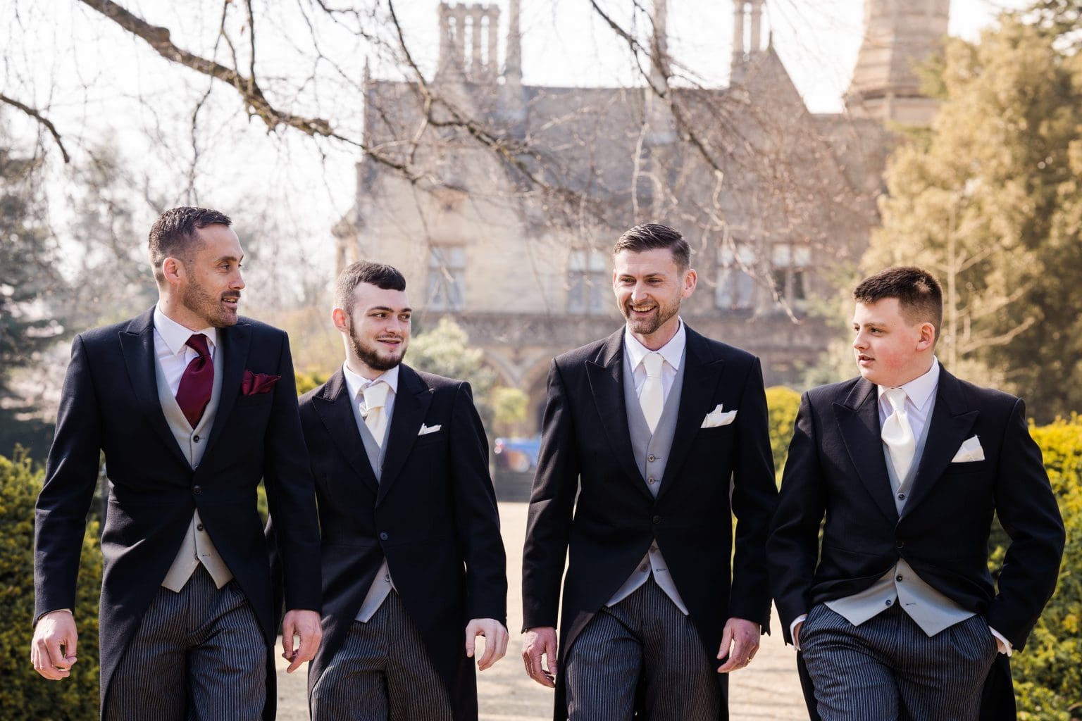 Groomsmen take a walk on the grounds of Manor by the Lake