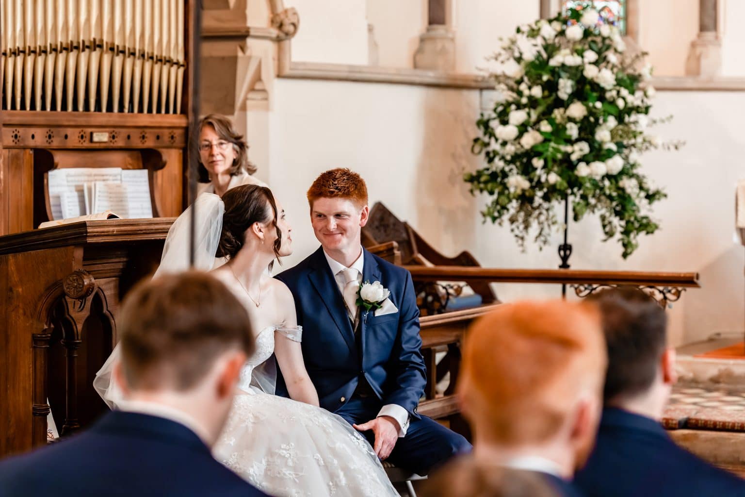 Couple smiling at each other inside the church