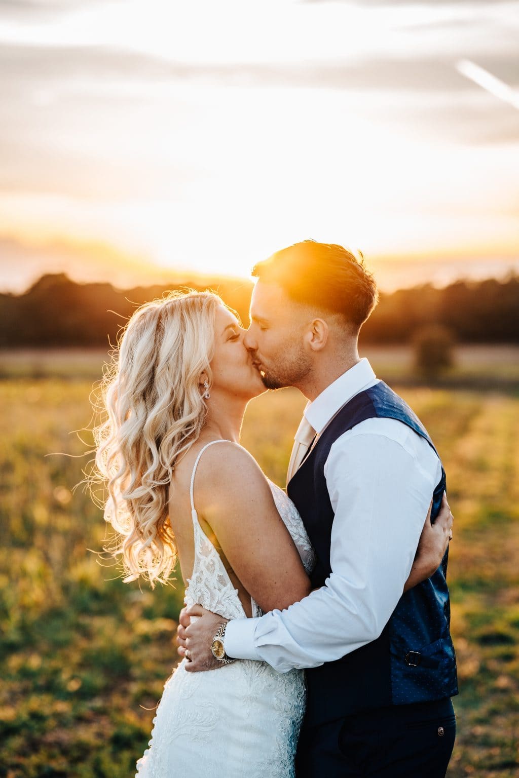 Magnificent sunset kisses for this newlywed couple at Cirencester Wedding Venue Old Gore by Yard Space