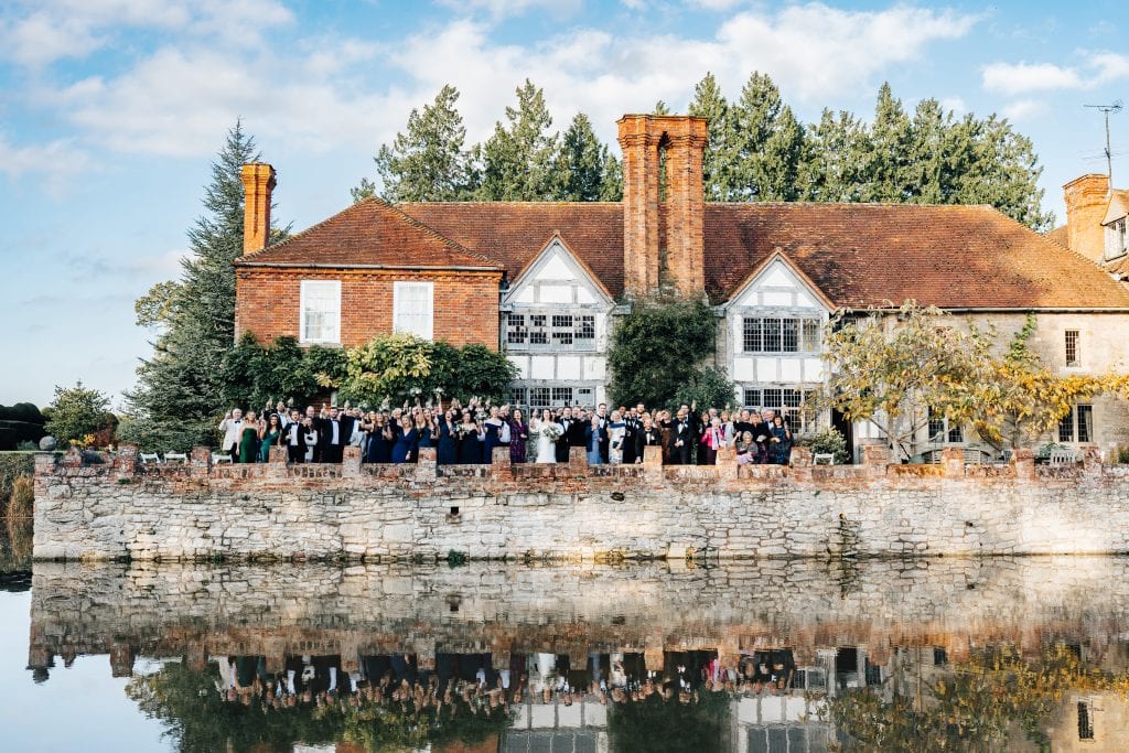 Using the old manor house at Birtsmorton Court as one hell of a backdrop for the big group wedding photo