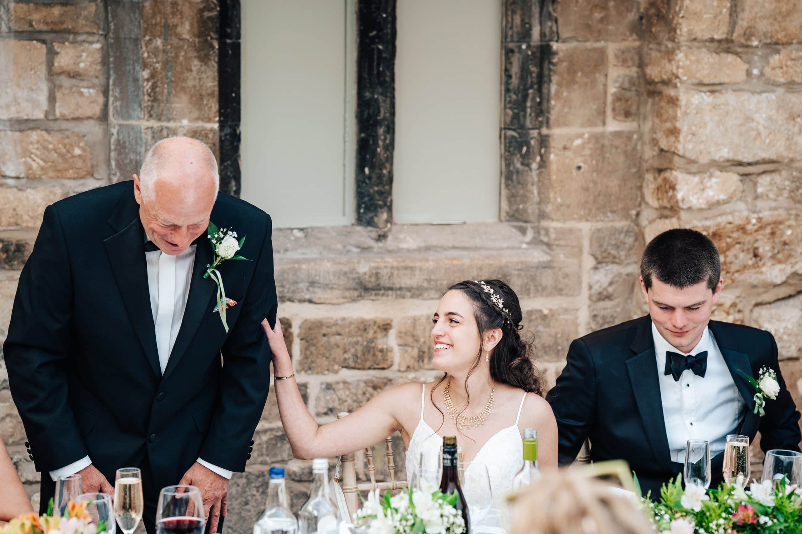 Father of the bride stands up to deliver his speech at Ellenborough Park Hotel, Cheltenham
