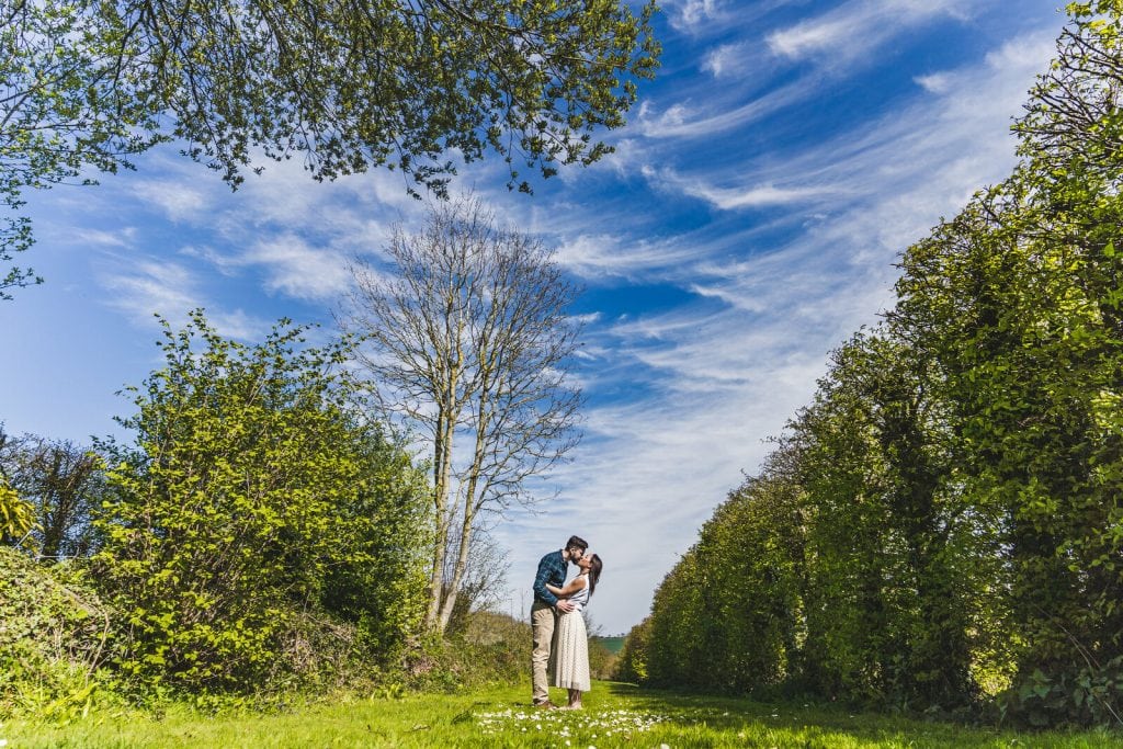 A stunning sky makes for a perfect backdrop for this pre-wedding photoshoot kiss for Jen & Rupert, located in the glorious Herefordshire wedding venue Broadfield Court